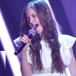 11-year-old enters the stage and announces that she will sing Elvis’ Can’t Help Falling in Love. Everyone was doubtful at first, but after she sang the first notes, the room became silent