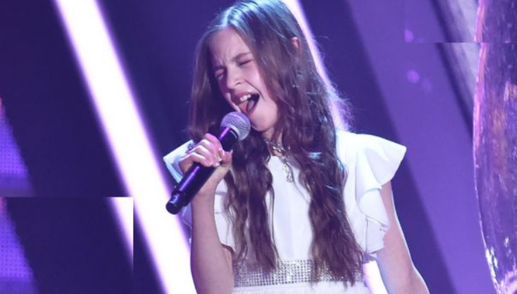 11-year-old enters the stage and announces that she will sing Elvis’ Can’t Help Falling in Love. Everyone was doubtful at first, but after she sang the first notes, the room became silent