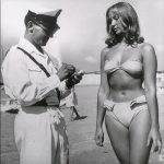 At first glance, it looks like a harmless photo of a woman on the beach – but look closer and you’ll see the hidden detail